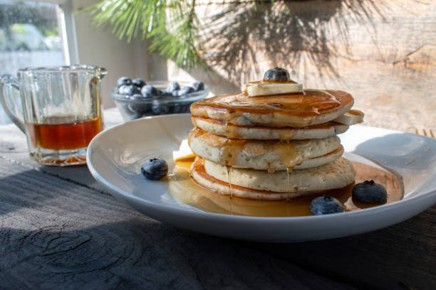 istock blueberry pancakes with butter and syrup 1295865421