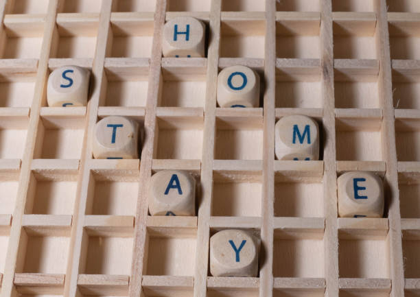 istock Wooden Letters Text Stay Home 1295865543