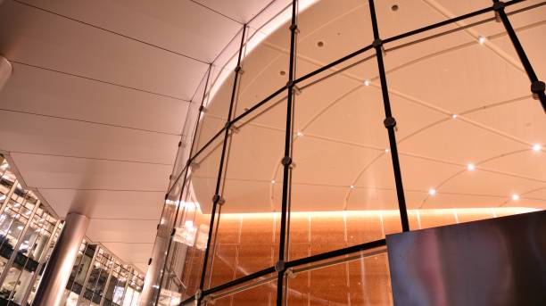 Pattern of office buildings windows illuminated at night.