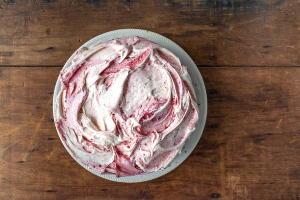 istock round cream cheese icing red velvet cake top view on rustic background 1295866413