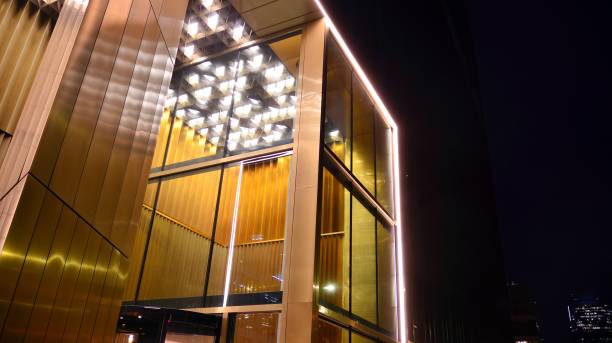 istock Pattern of office buildings windows illuminated at night. 1295866478