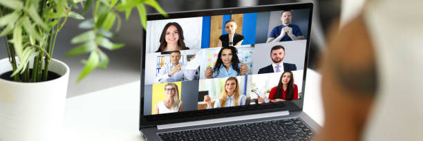 istock Woman talking with international colleagues using online video chat service 1295868784
