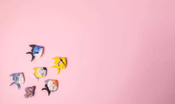 istock Plush fishes soft isolated on pink background 1295868815