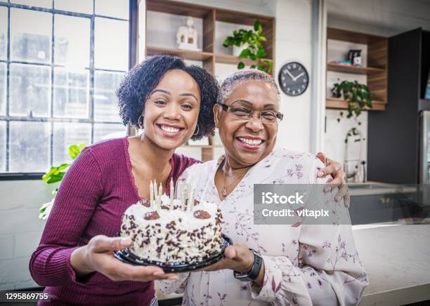 Celebrating Grandmas Birthday Stock Photo - Download Image Now - Birthday, African-American Ethnicity, Senior Adult