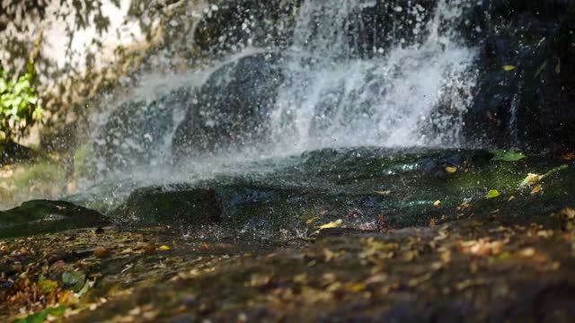 Drops falling on the ground,beautiful waterfall, water splashes,texture of drops,rain video wallpaper.