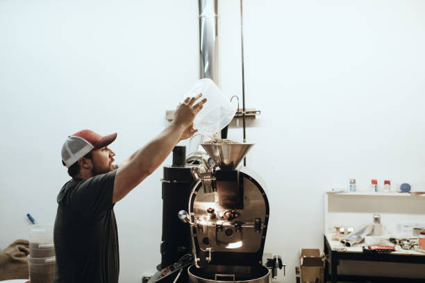 istock Cafe Owner Roasting Coffee For Small Business 1295874366