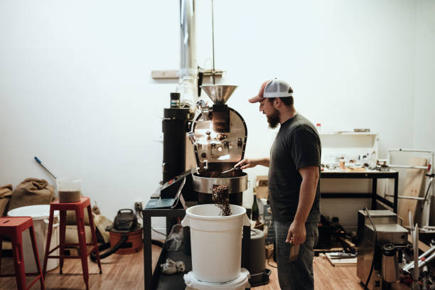 istock Cafe Owner Roasting Coffee For Small Business 1295874932