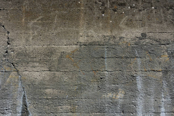 istock Old Cracked and Weathered Cement Wall 1295876026