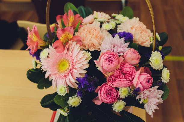 istock A flower bouquet with a lot of a different flowers. 1295877458
