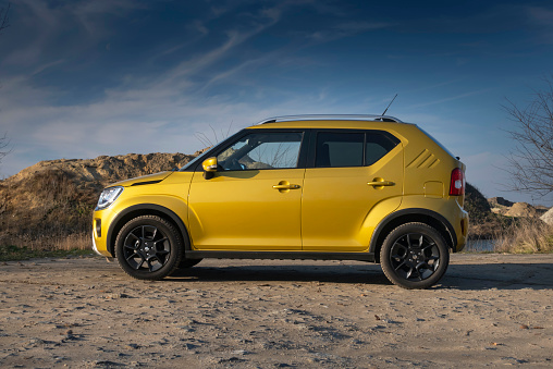 Side, Turkey -January 27, 2023:   silver Volkswagen Polo is parked  on the street on a warm summer day against the park