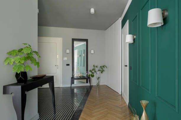 istock Spacious apartment corridor with stylish green wall 1295883941