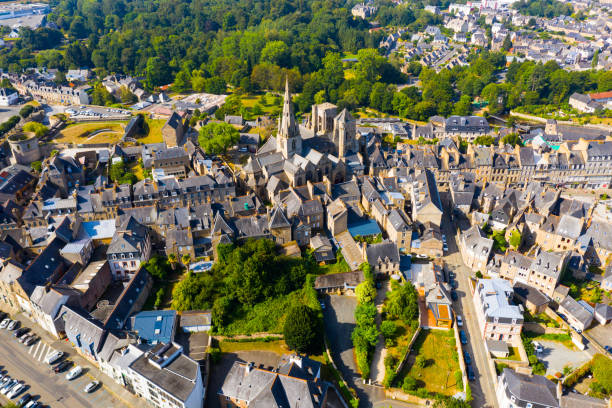 Flight over the city Guingamp and Basilica of Our Lady of Merciful on summer day Flight over the city Guingamp and Basilica of Our Lady of Merciful on summer day. France guingamp stock pictures, royalty-free photos & images