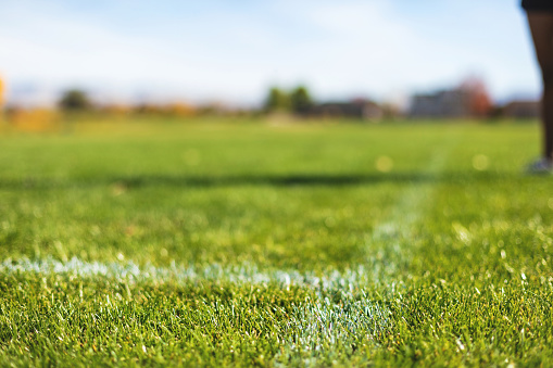 Athletic Playing Field Park Ball Field With Strip in Grass for Sports Boundary (Shot with Canon 5DS 50.6mp photos professionally retouched - Lightroom / Photoshop - original size 5792 x 8688 downsampled as needed for clarity and select focus used for dramatic effect)