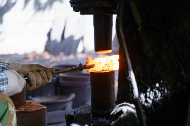 istock The blacksmith is forging very hot iron to make various tools. 1295888869