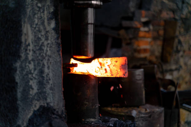 istock The blacksmith is forging very hot iron to make various tools. 1295888984