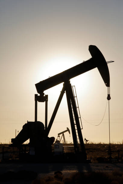 pumpjacks, the sunset of new mexico oil field - sunset petroleum silhouette new mexico imagens e fotografias de stock