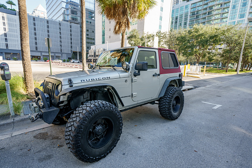 Fort Lauderdale, FL, USA - January 9, 2021: Two door Jeep Wrangler Rubicon lifted with oversized tires for trail riding 4x4