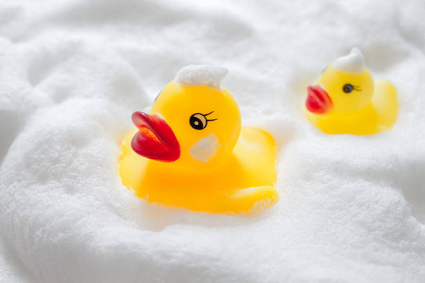 istock Duck toys and bubbles. Bathing image. 1295893713