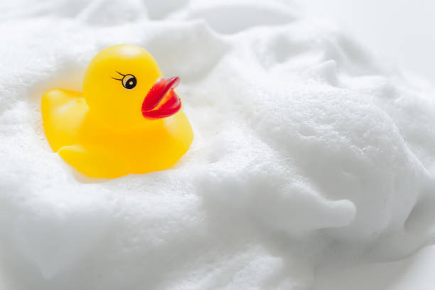 istock Duck toys and bubbles. Bathing image. 1295893747