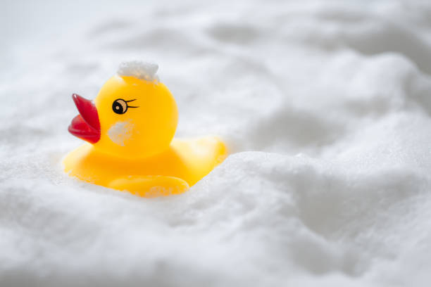 istock Duck toys and bubbles. Bathing image. 1295893752