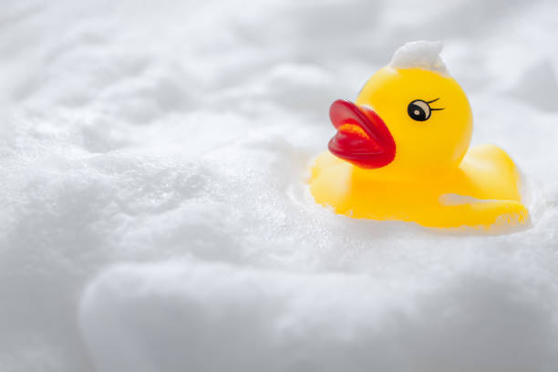 istock Duck toys and bubbles. Bathing image. 1295893767