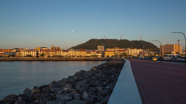 istock Watching the sunrise on the city shore 1295894884