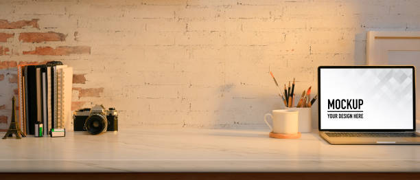 istock Home office room with laptop, stationery, camera and copy space 1295895082