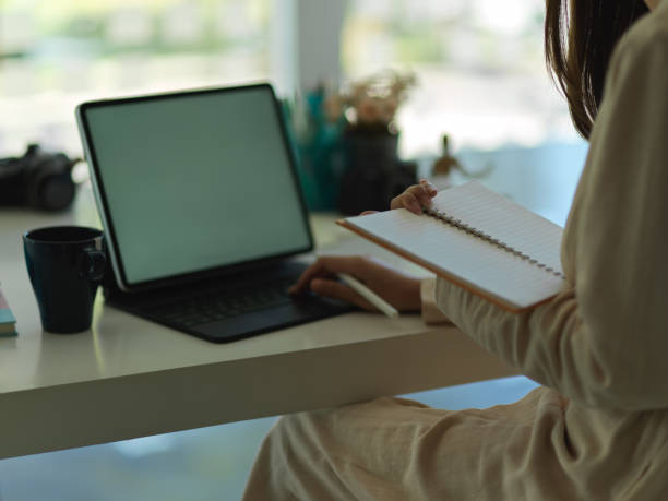 istock Businesswoman working with digital tablet on worktable 1295896611