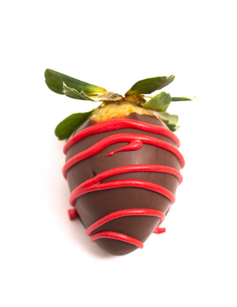 istock Chocolate Covered Strawberries with Red Drizzle Isolated on a White Background 1295896779