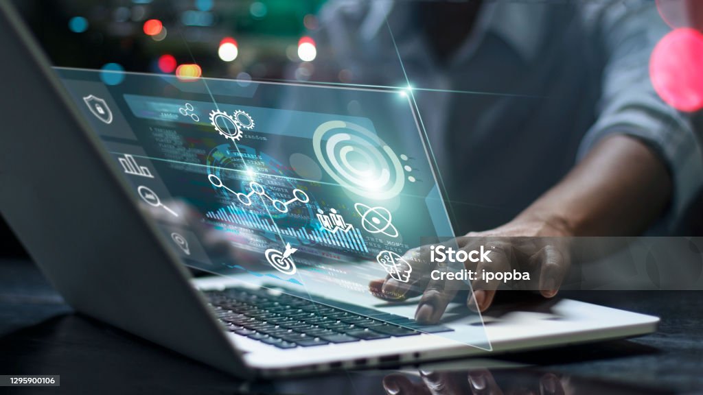 Data scientists. Male programmer using laptop analyzing and developing in various information on futuristic virtual interface screen. Algorithm. marketing and deep learning of artificial intelligence Technology Stock Photo