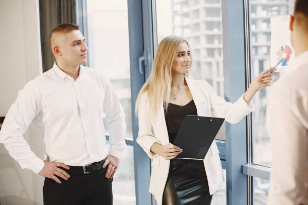 istock Young team working together and use the laptop 1295900298