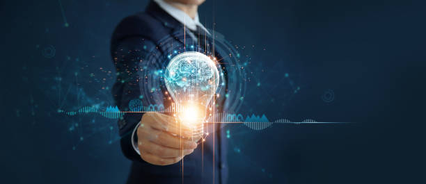 istock Businessman holding light bulb and brain inside, Idea and imagination, Creative and inspiration, Science innovation with network connection, Solution analysis and development, Innovative technology. 1295902084