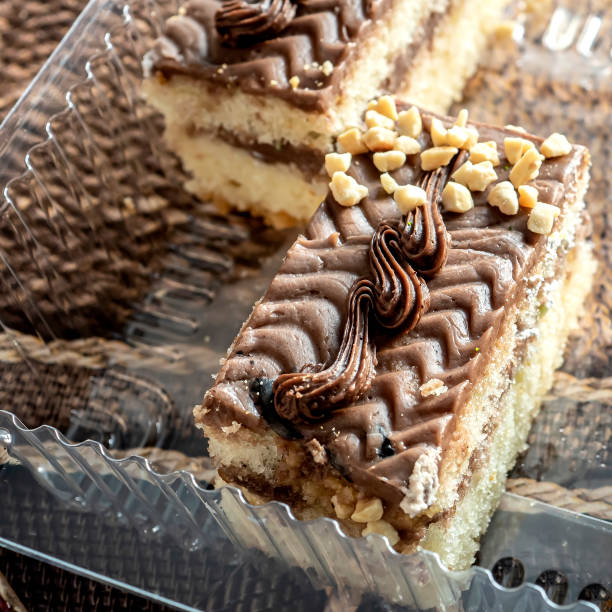 istock piece of chocolate cake with dark cream 1295902621