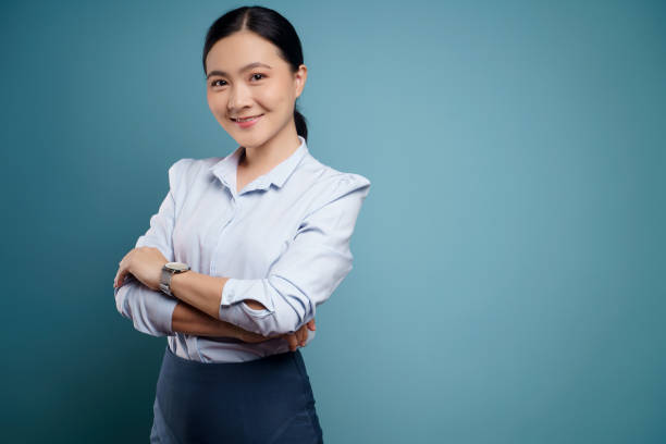 istock Asian woman happy surprised isolated on blue background. 1295908132