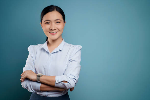 istock Asian woman happy surprised isolated on blue background. 1295909033
