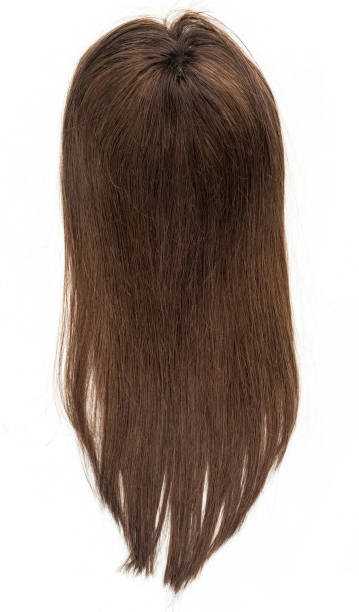 istock A long straight brunette wig, toupee or hair topper against a plain white backdrop. 1295911078