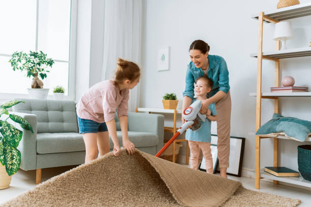 istock family cleaning the room 1295913594