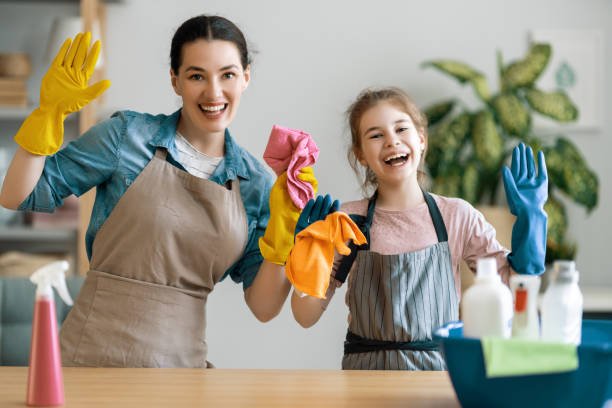 istock family cleaning the room 1295913612