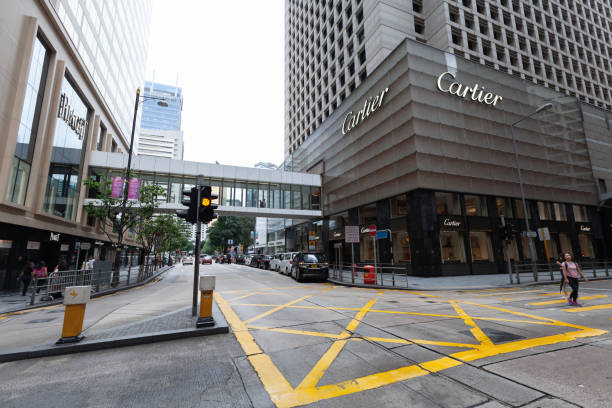 Street view of Hong Kong downtown Hong Kong - July 15, 2017: Street view of Hong Kong downtown, ordinary people walk the street near Cartier boutique business architecture blue people stock pictures, royalty-free photos & images