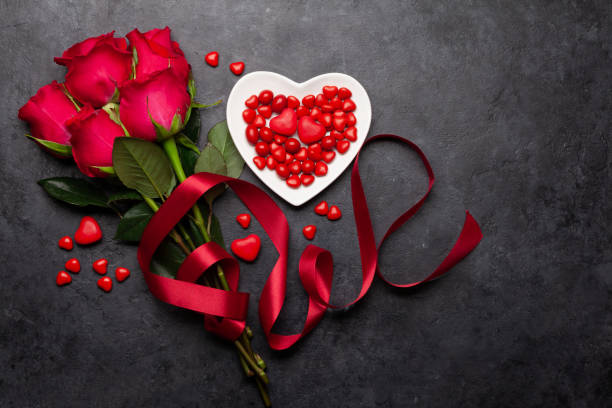 istock Valentines day greeting card with red rose flowers 1295916719