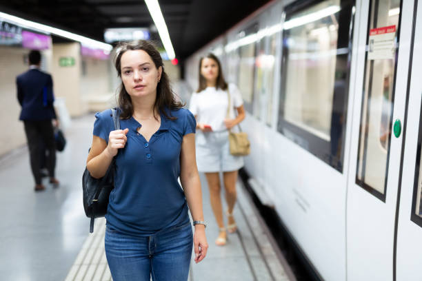 istock Female waiting for subway train 1295920418