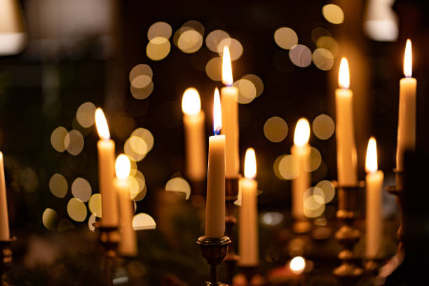 istock burning candles in candlesticks in a dark interior. romantic dinner. New Year 1295921073