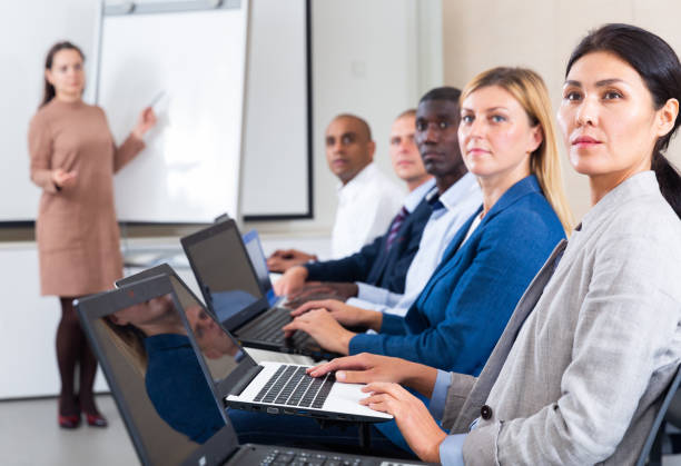 istock international group of businessmen with computer at world training courses 1295921366