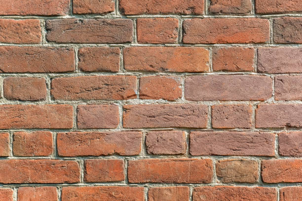 istock Old brick wall of a residential building. 1295922516
