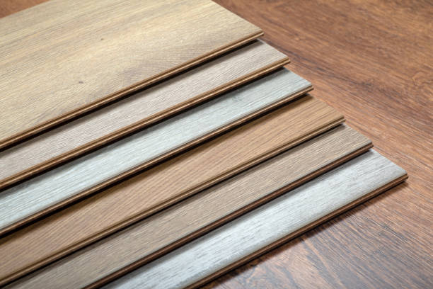 istock Laminate background. Samples of laminate or parquet with a pattern and wood texture for flooring and interior design. Production of wooden floors 1295923496