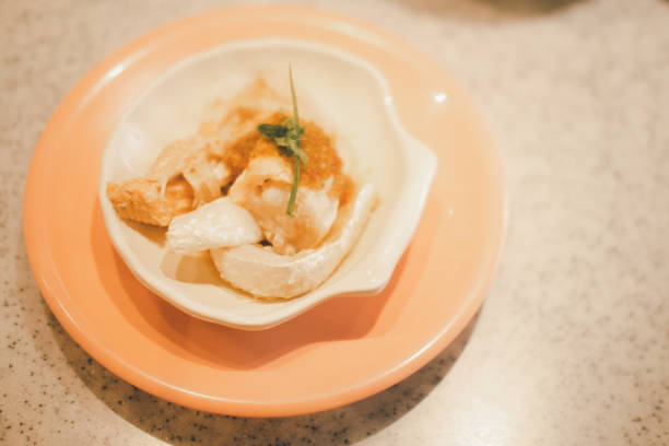 istock Boiled salmon skin in dish shellfish shape. Close up 1295924939