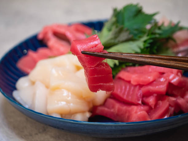 istock Assorted fresh scallops and tuna sashimi. Close up of fresh tuna. 1295927802