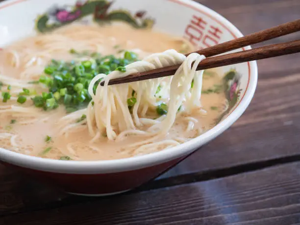 Hakata gourmet in Japan. A close-up of tonkotsu ramen topped with a lot of green onions.