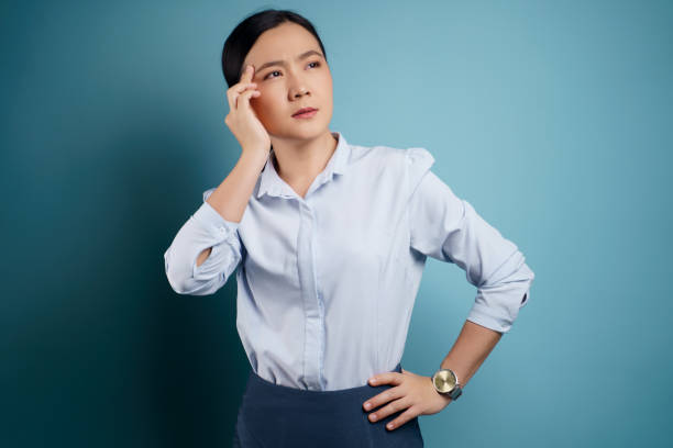 istock Asian woman was sick with headache. 1295930115