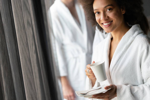 istock Woman in bathrobes enjoying tea during wellness weekend 1295932317